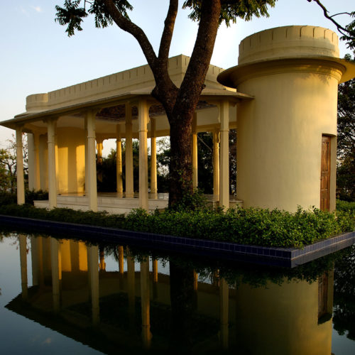 Indian building in the middle of a pool