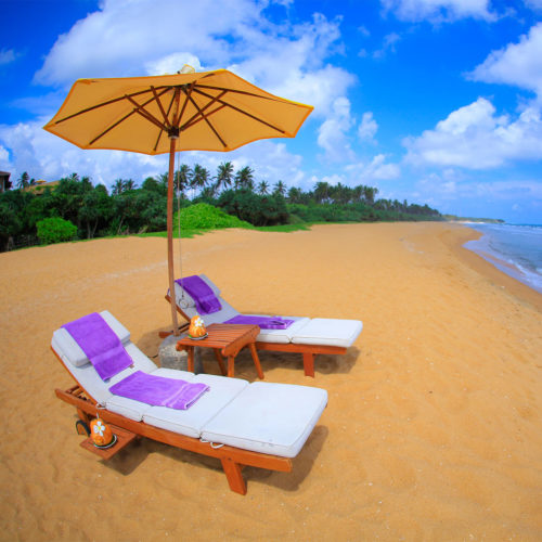 Sun beds on the beach at the aditya resort