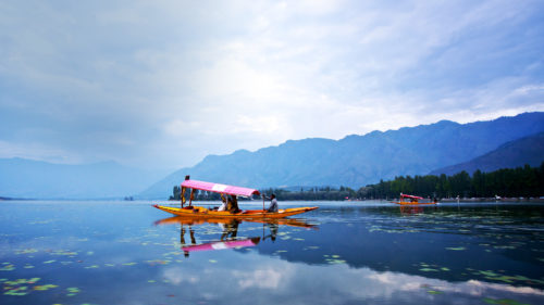 People on a river boat tour in India