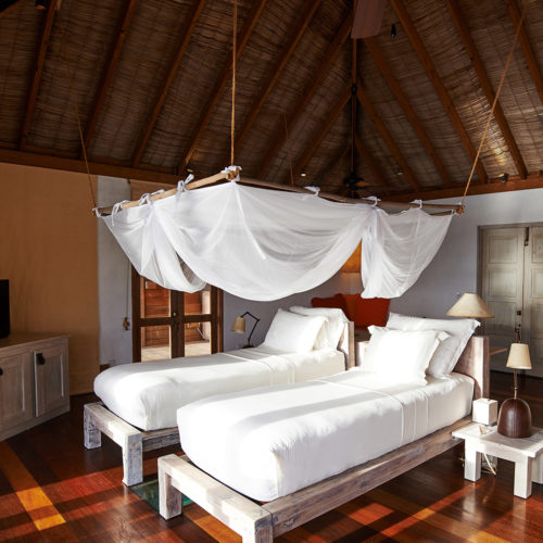 A bedroom in the gili-lankanfushi resort