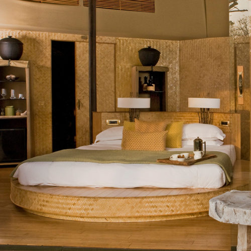A bedroom in the Taj Manjaar Tola bedroom resort