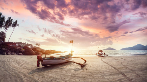 Goa beach. Fishing boat at sun rise