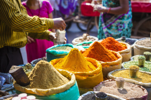 Colorful spices, powders and herbs in a traditional street market in Delhi in India
