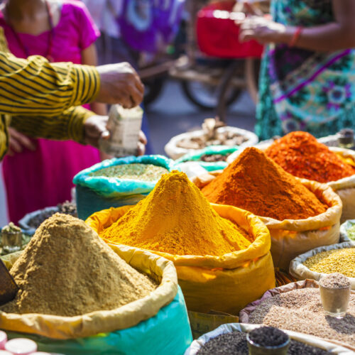 Colorful spices, powders and herbs in a traditional street market in Delhi in India