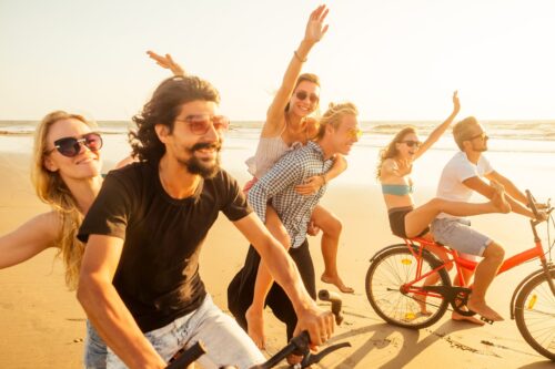 Group activities in Goa - cyclists on a beach