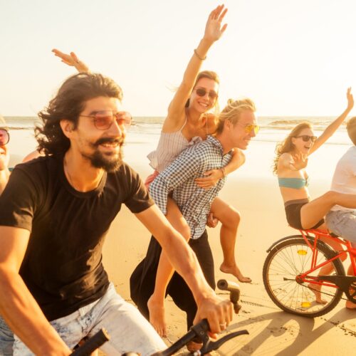 Group activities in Goa - cyclists on a beach